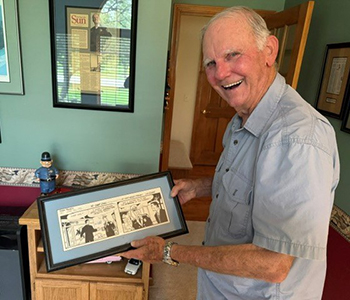 Dave with a Dick Tracy comic that mentions his name