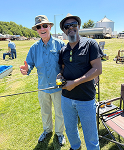 Helping teach fly fishing technique