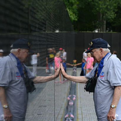 First Honor Flight with a Vietnam Veteran visiting the memorial wall.